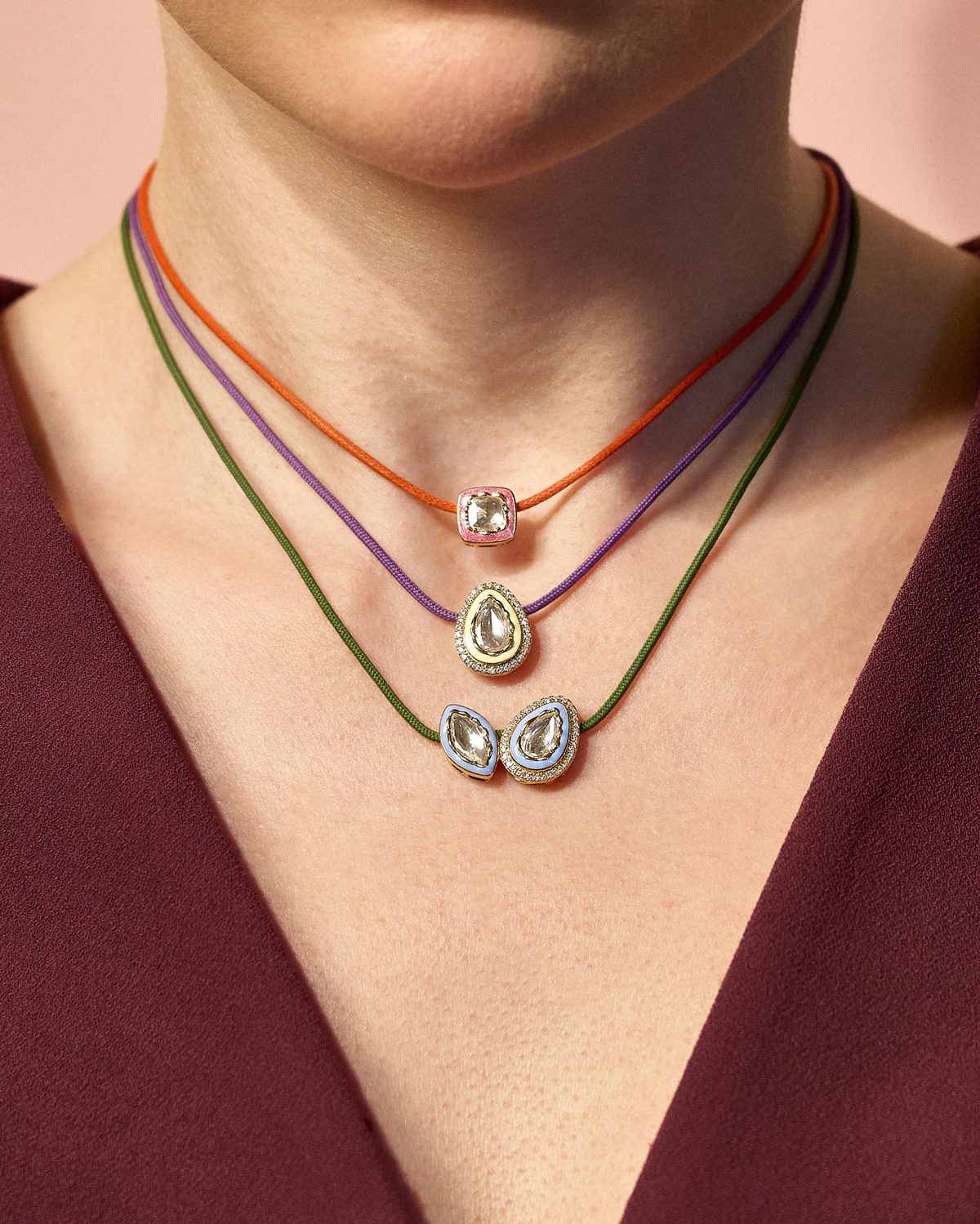 Three VIXII cord necklaces worn together